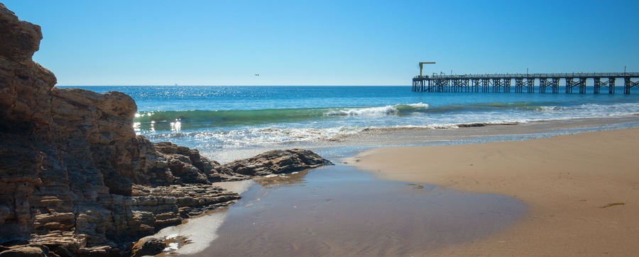 Fishing pier and boat hoist at Gaviota Beach on the central coast of California United States