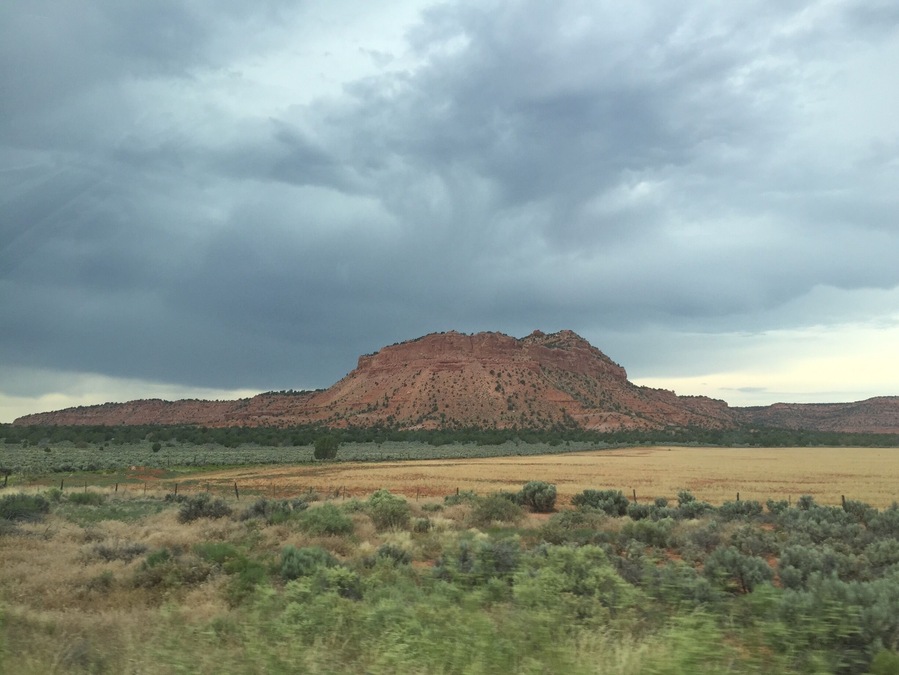 The drive from Fredonia to Colorado City, AZ on hwy 389 provides scenery similar to this. The looming storm just added to the visual effects.