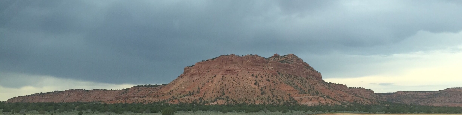 The drive from Fredonia to Colorado City, AZ on hwy 389 provides scenery similar to this. The looming storm just added to the visual effects.