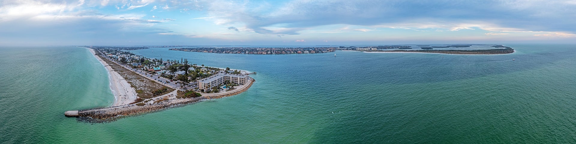 Drone panorama over Pass-a-Grille beach on Treasure Island and Pine Key area in St. Petersburg in Florida during sunset