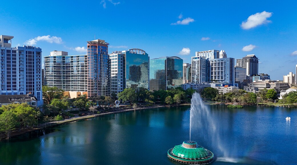 Fountain at Lake Eola with high-rises in background at downtown Orlando in Orange County, Florida.