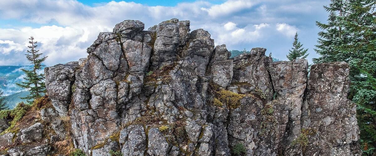 I don't think anyone gets motivated to hike a 10+ mile trail to end up at a place called Chicken Rock. Our primary destination was a little farther up the trail, at Rooster Rock (not the one in the Columbia Gorge),
My hiking partner grew tired of the ascent short of Rooster Rock, so we veered left and parked ourselves near its more diminutive cousin.
Not a particularly bad hunk of mineral to plant your flag on, but boy, do they need to change the name.