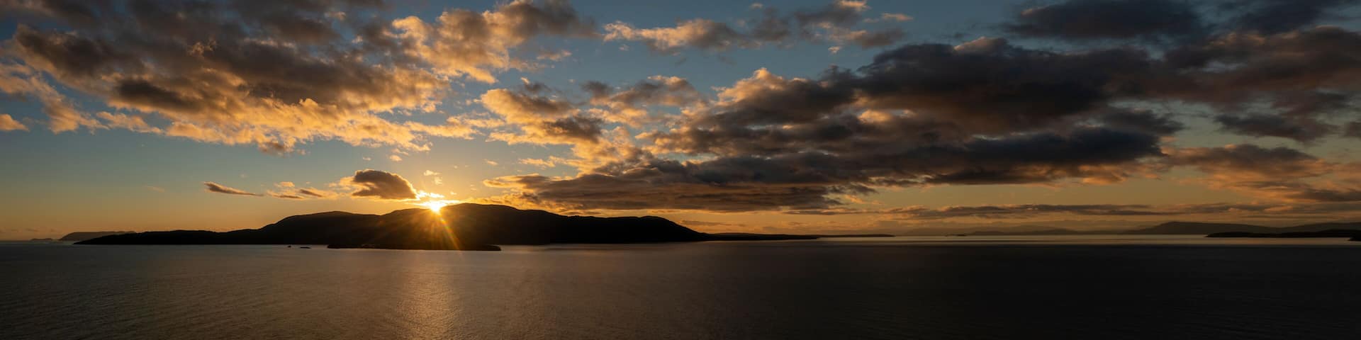 Beautiful Sunset Over Orcas Island, Washington. Orcas Island is the largest of the San Juan Islands of the Pacific Northwest, which are in the northwestern corner of San Juan County, Washington.