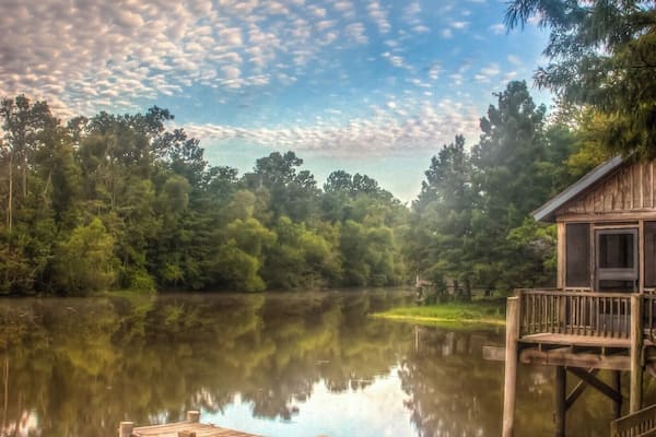 We toured Louisiana a while back and spent a couple of nights at Lake Fausse Pointe State Park.
It was pretty cool to be surrounded by such unspoiled nature.
You have a couple of options for your stay there: camping or one of their waterside cabins. We opted for the later and it was an amazing experience - especially the alligators swimming under our porch!
There are a lot of activities around: boat, canoe, cycling, and some nice walks.