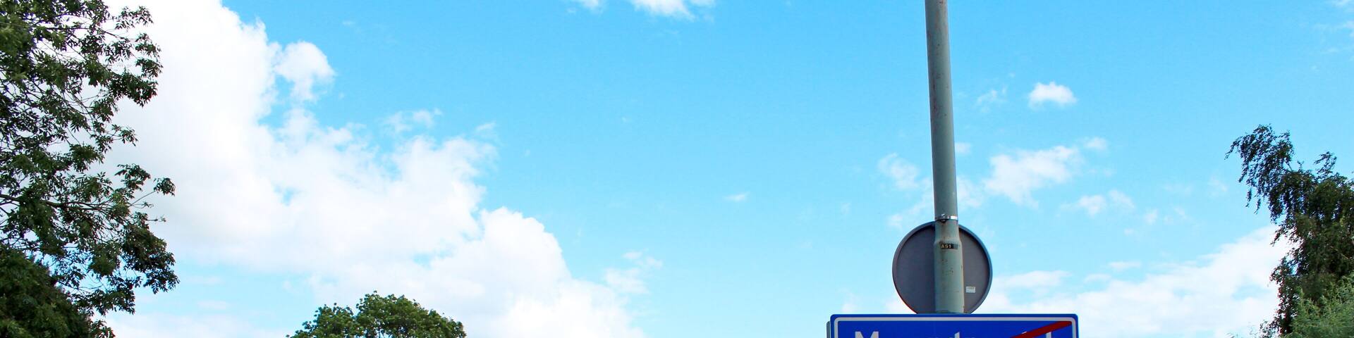 Sign of end urban area of Moordrecht in the Netherlands, part of municipality Zuidplas at the quay of the ferry over river Hollandsche IJssel