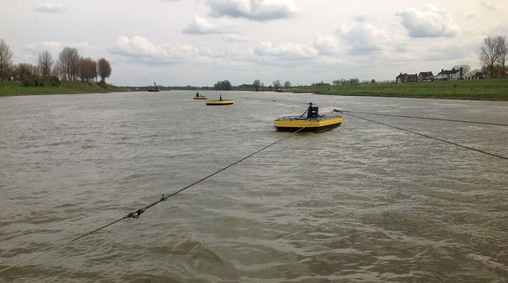 Three small boats connected by cables. Guess why.