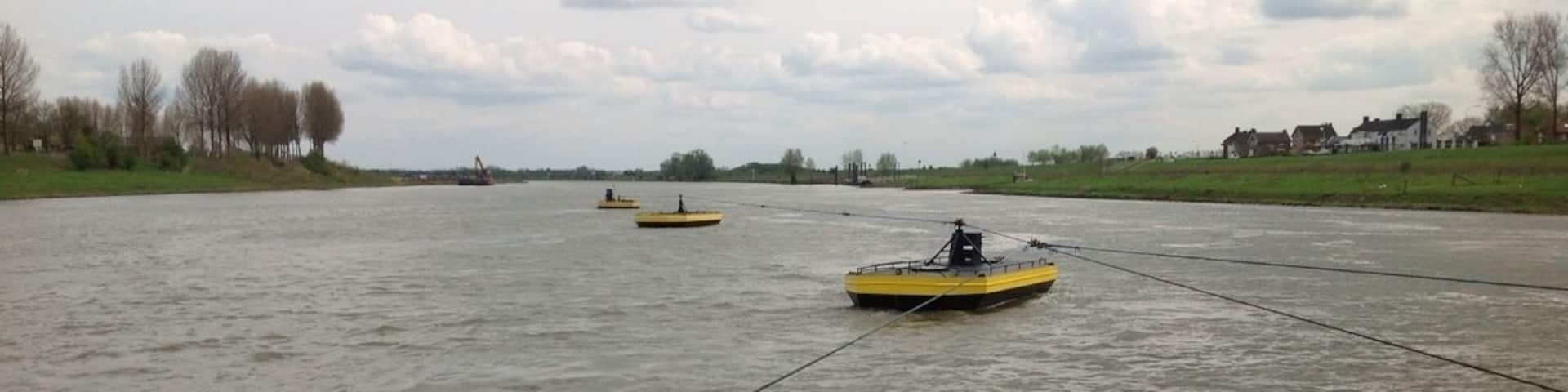 Three small boats connected by cables. Guess why.