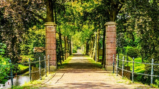 Brick Gate posts and tree lined lane into an Estate in the historic village of Midden Beemster in the Beemster Polder in the Netherlands