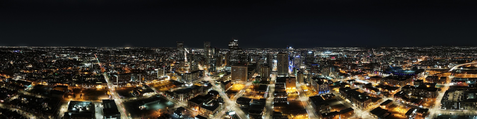 panorama of city skyline at night with city lights Denver Colorado