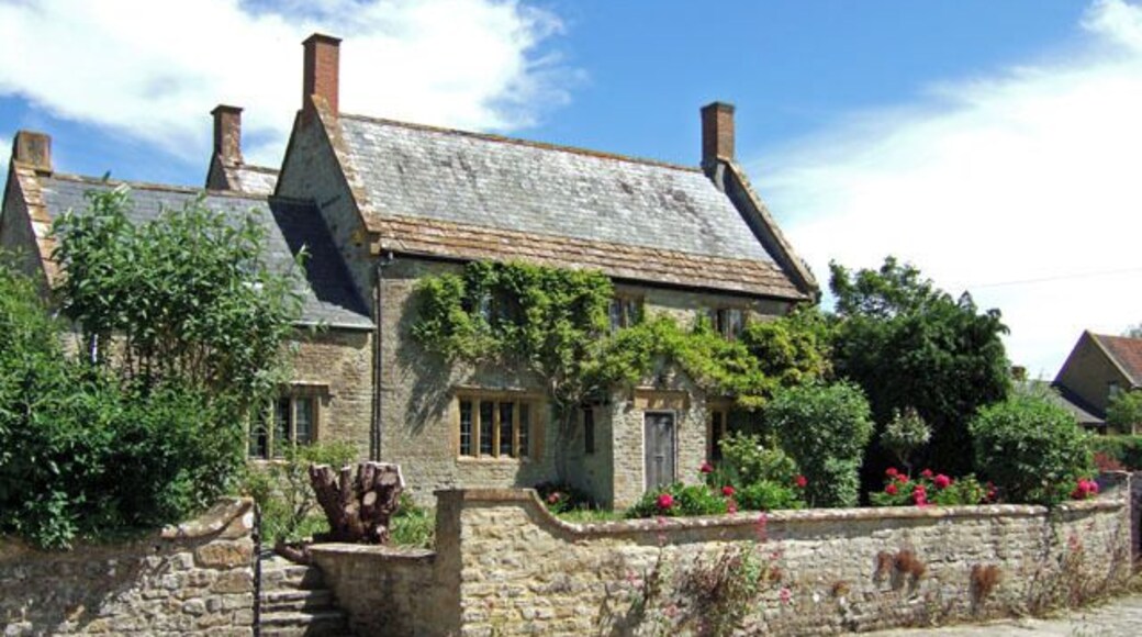 Manor Farmhouse - Trent Grade II listed detached farmhouse, dated 1660, with a range to the rear of the C18, and with C20 restoration. The owner told me the main property was originally thatched, as many such houses were, traces of which were found in the roof void (note the parapet at the gable ends to contain the thatch). In more recent times, the thatch was replaced with Welsh slates, the stone tiles at the bottom of the roof being retained. Stone tiles were mostly used here in Dorset just at the eaves, where the load bearing supporting walls could take their weight.