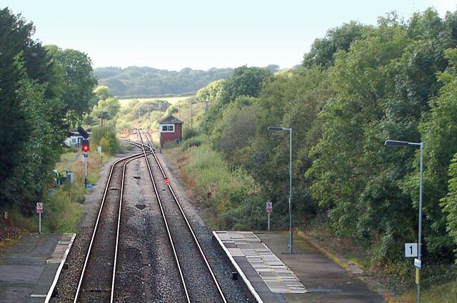 Clarbeston Road railway station photo survey (6) Looking east from the road bridge at Clarbeston Road station towards Clarbeston Road Junction (see below). Clarbeston Road railway station is on the West Wales line from Swansea to Pembrokeshire. Immediately west of the station, the line divides at Clarbeston Road Junction, one branch serving the ferry terminal at Fishguard, the other serving Haverfordwest and Milford Haven. The station is managed by Arriva Trains Wales who operate most of the passenger services. Arriva runs an hourly service from Manchester Piccadilly as far Carmarthen: this service is extended to Clarbeston Road, Haverfordwest and Milford Haven every two hours. There are usually two services each day to Fishguard to coincide with ferry sailings to Ireland.