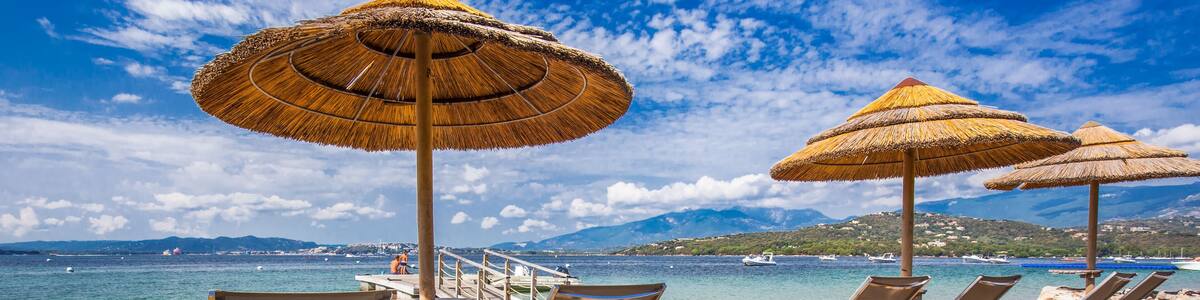 Beach chairs on a white sandy beach in San Ciprianu, Corsica, France, Europe