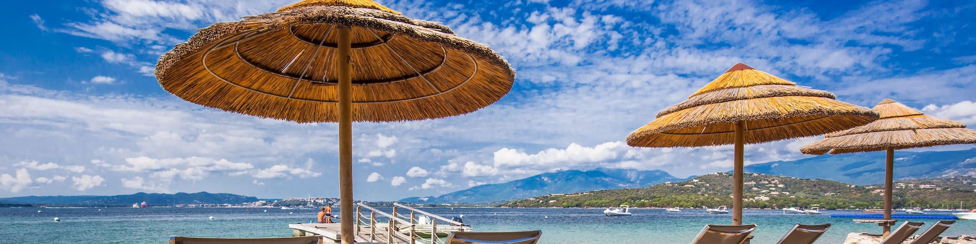 Beach chairs on a white sandy beach in San Ciprianu, Corsica, France, Europe
