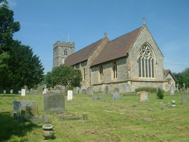 A church with a tower and a graveyard.