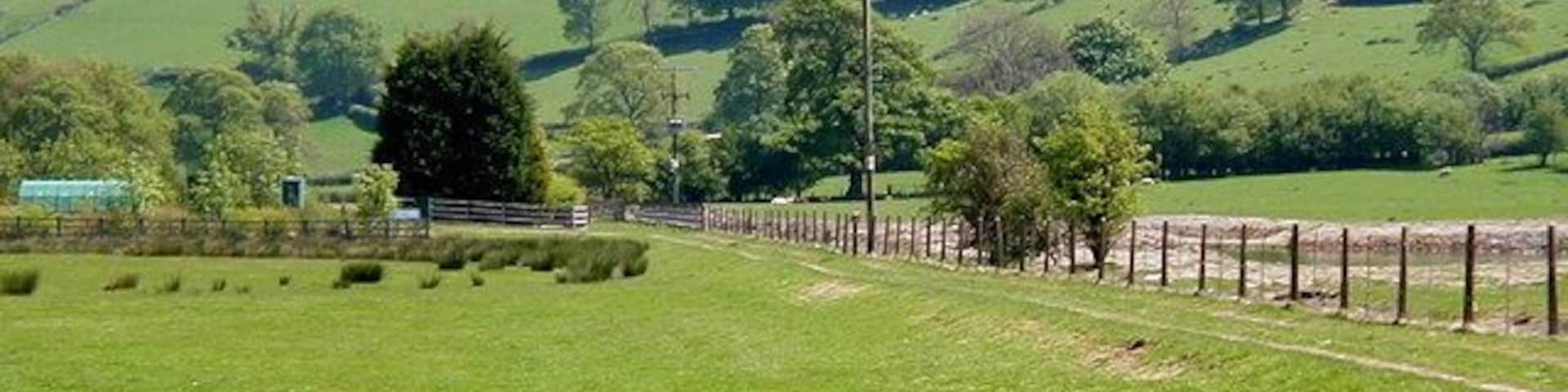 Van Railway Track bed, near to Y Fan, Powys, Great Britain. The track bed can be seen alongside the fence. The railway ran from Van to Caersws, its main purpose being to service the lead mine near here. The mine closed in the 1920's and presumably so did the railway.