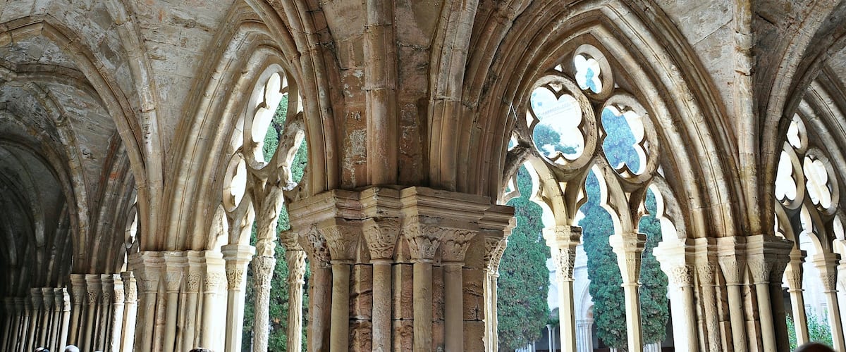 A stone cathedral interior with arched ceilings and columns.