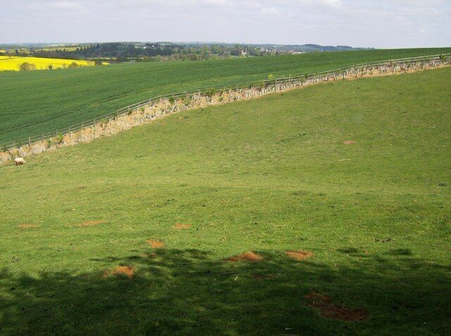 View from Church Stowe Looking north-east towards the valley of the River Nene containing the canal, railway, Roman road and M1. The peaceful pastures below the church here seem miles away from all that.