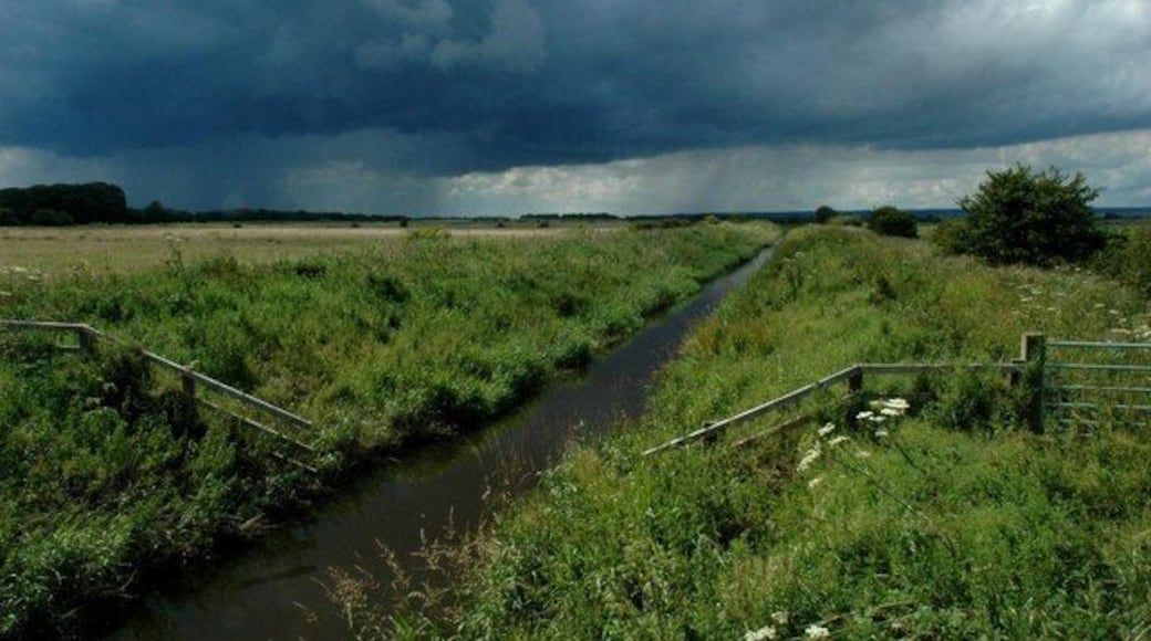 The River Hertford from Flixton Bridge, looking west Looking towards the former Mesolithic lake settlement of Star Carr. The approaching thunderstorm in the distance inflicted the soaking of a lifetime on the photographer!