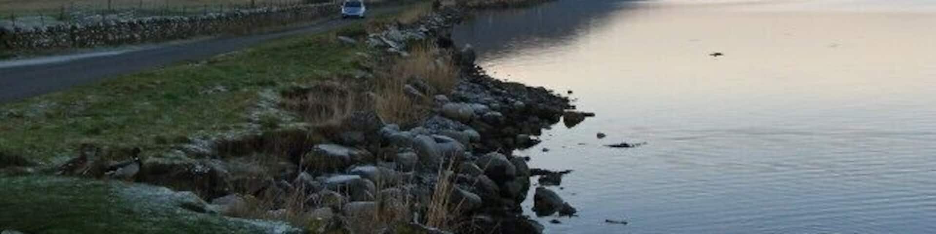 Loch Fleet. Looking west along the south shore of Loch Fleet to Creag an Amalaidh.