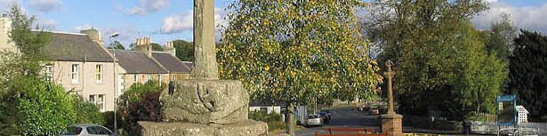 Ancrum Market Cross This late 16th century cross is situated on the village green. The head is missing from the stone shaft. Behind is the war memorial, erected in 1920, in the form of a market cross in red sandstone.