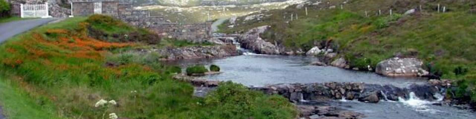 River at Amhuinnsuidhe Castle The public road to Hushinish goes staight through the castle grounds and directly in front of the building. The castle gates can be seen on the right of picture.