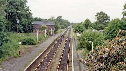 Ashley (Cheshire) station, 1992. View northward, towards Altrincham and Manchester: ex-Cheshire Lines (CLC) Manchester - Altrincham - Northwich - Chester secondary main line. Since 5/5/69 when Manchester Central closed, the service has run via Oxford Road to Piccadilly and on 6/10/69 their Chester Northgate terminus was closed and the trains then ran to Chester General.