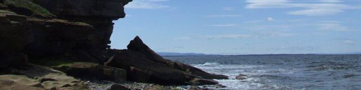 Cliffs on Burg Head Steep cliffs lie at the tip of the headland and are a reminder of the good defensive attributes of the site.