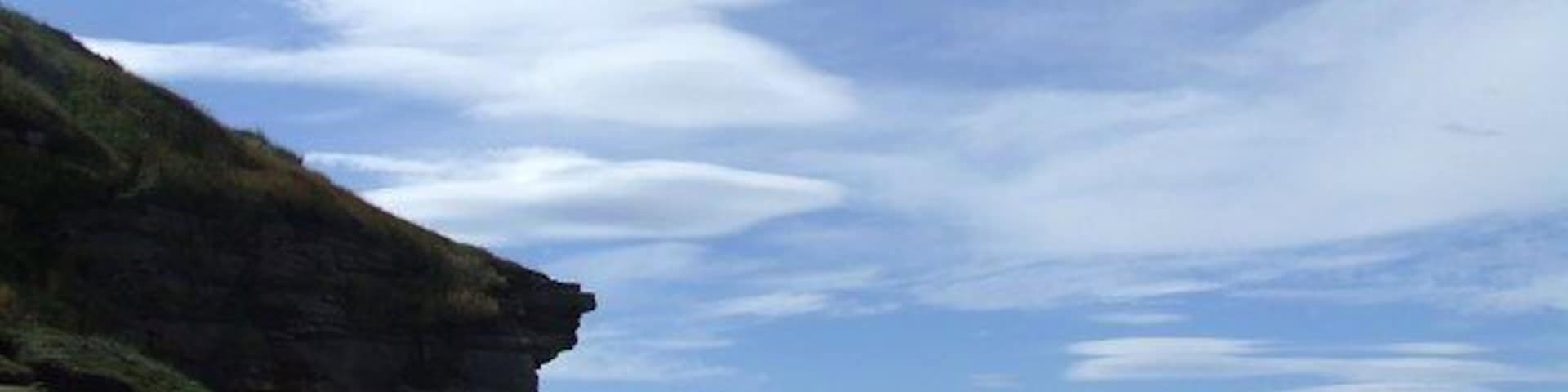 Cliffs on Burg Head Steep cliffs lie at the tip of the headland and are a reminder of the good defensive attributes of the site.