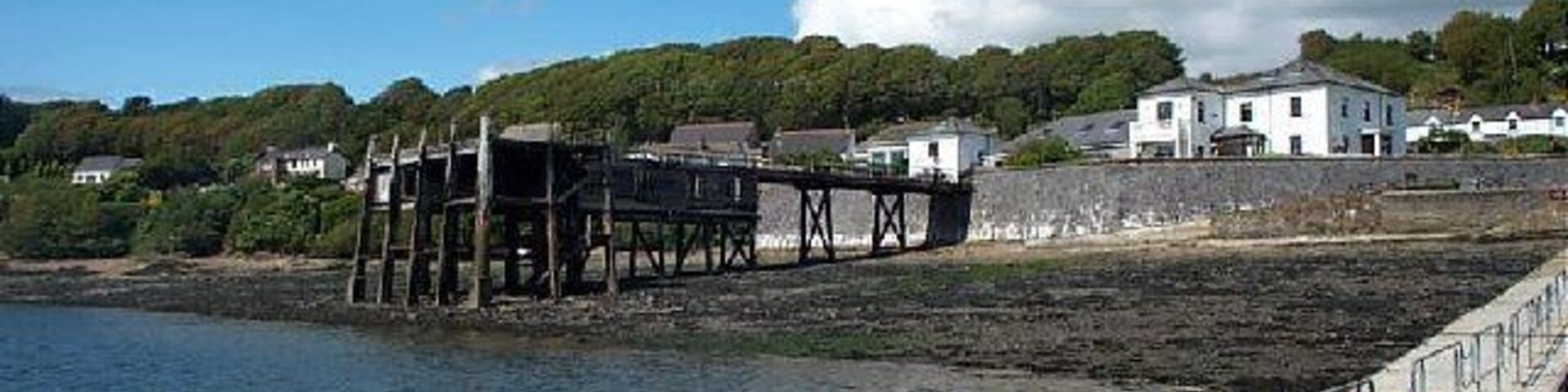Burton Ferry. This shows the disused pier and Trinity House. Trinity House was built in 1861 as a depot for lightships and lighthouses between Swansea and North Wales with the jetty providing a landing stage and storage in its underslung rooms.