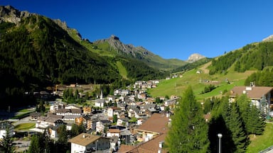 A mountain town with houses, a church, and a railway station.