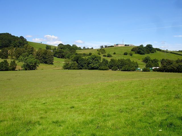 Fields north of the church, Kerry On the left is Dolforgan Wood. The building and mast on top of the hill are at Red House Farm, just in SO1590.