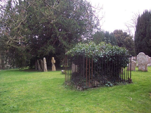Ivy covered tomb at St Thomas a Becket Church, Tilshead