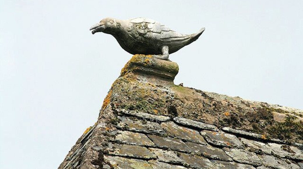 Roof detail at Traquair House. This lead ridge finial on the north wing roof 895638 represents a crow, which is part of the family crest.
