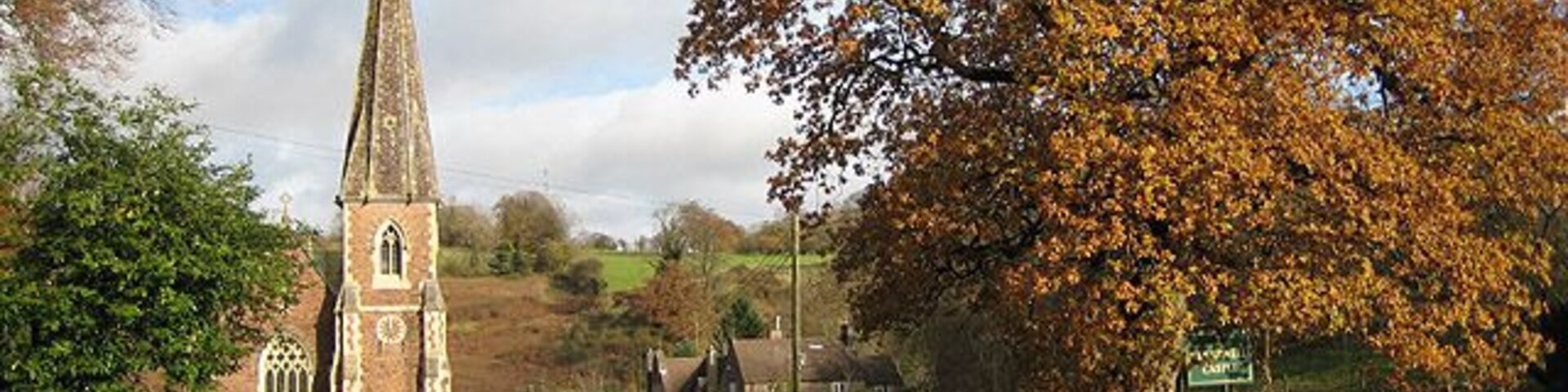 St Peter's Church, Clearwell Viewed from the driveway to Clearwell Castle. The church, designed by John Middleton of Cheltenham for Caroline, Countess of Dunraven, owner of the nearby Clearwell Castle (or Clearwell Court as it was known at that time), dates from 1866 and is of French Gothic style utilising local red sandstone with Bath stone dressings. The tower and spire stand at the southwest corner. The church replaced an earlier medieval church on a different site.