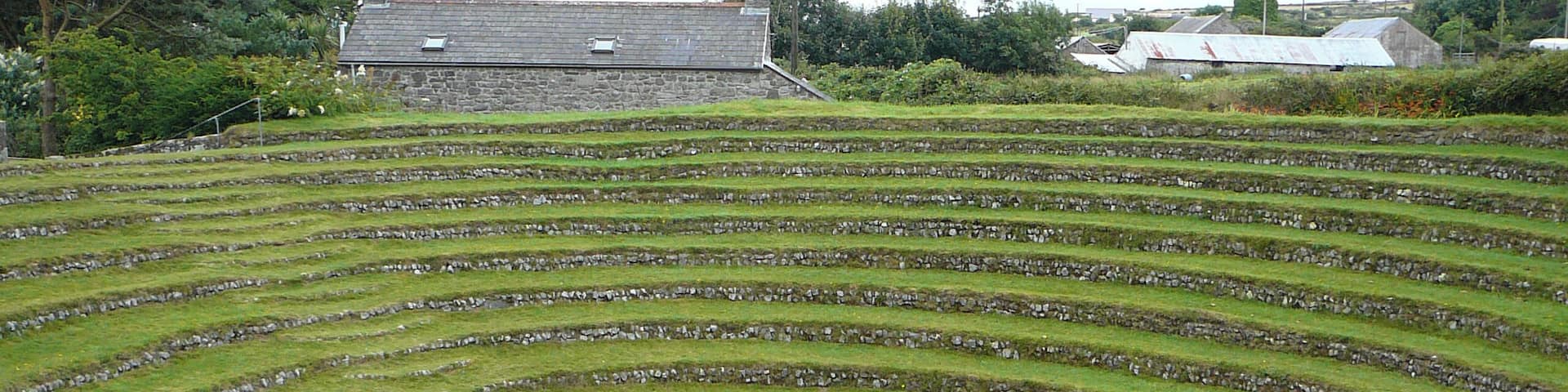 A high wind drove Wesley into Gwennap Pit for the first time on the Sunday evening of September 5 1762. That afternoon he had spoken in the open air at Redruth but "the wind was so high at five that I could not stand in the usual place at Gwennap. But at a small distance was a hollow capable of containing many 1,000 people. I stood on one side of this amphitheatre towards the top, with the people beneath and on all sides, and enlarged on those words in the Gospel for the day (Luke 10. 23, 24), 'Blessed are the eyes which see the things that ye see and ... hear the things that ye hear'." www.methodistrecorder.co.uk/cornwall.htm