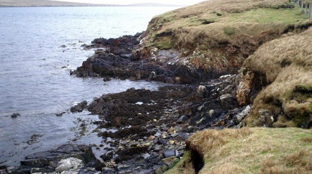 Coastline west of Ulsta The island of Bigga in Yell Sound is on the horizon.