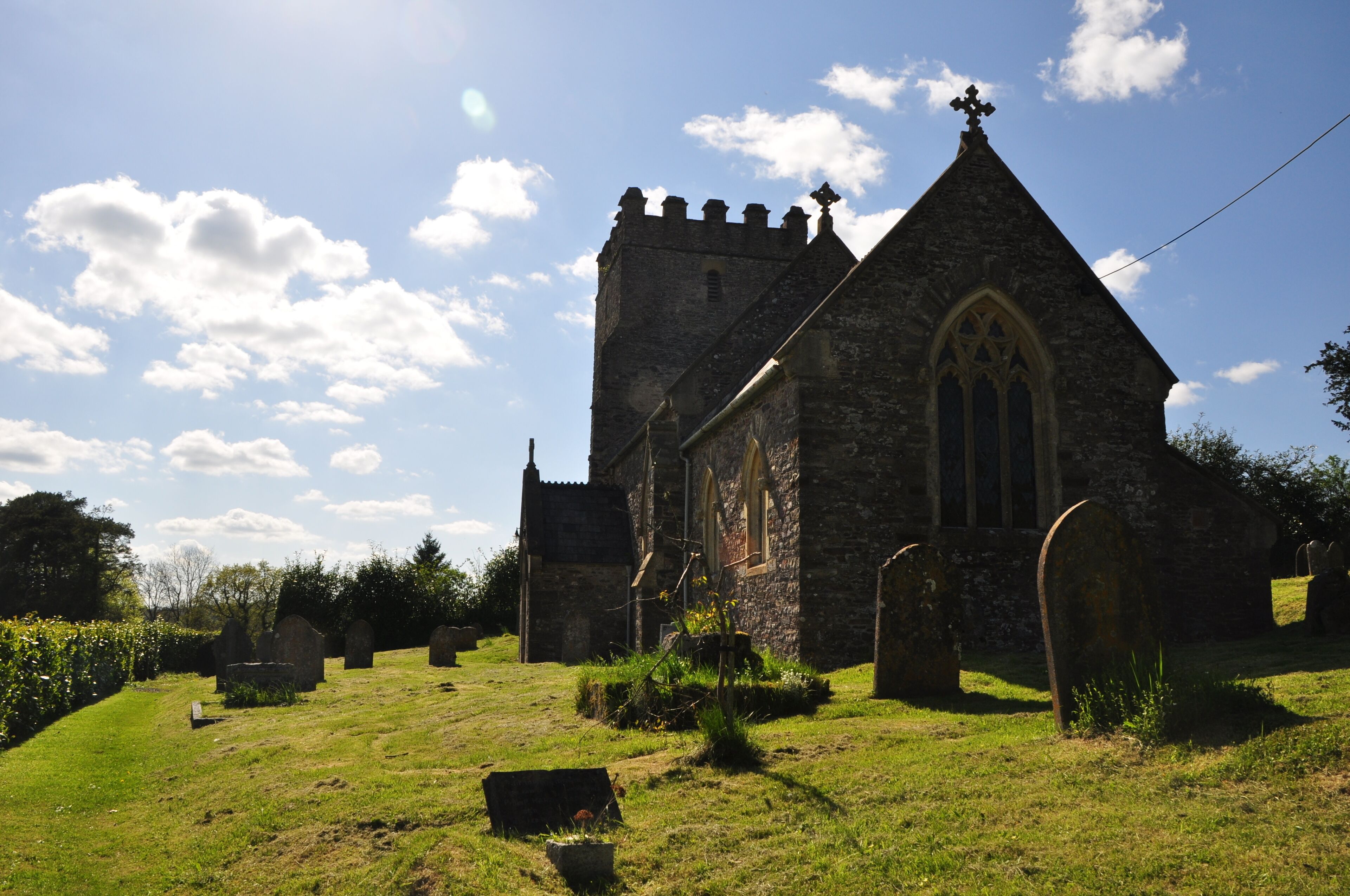 A historic church with a tall tower and pointed arches.