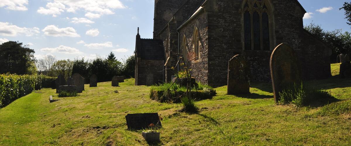 A historic church with a tall tower and pointed arches.
