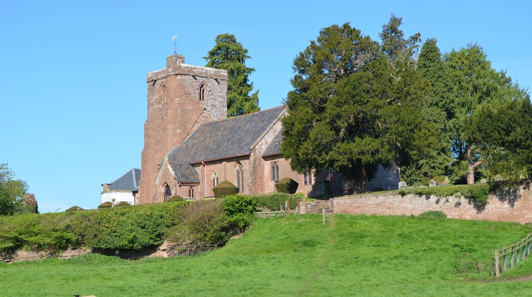 Grade I listed. The church dates from the 13th century when the nave and chancel were built. In the 14th century the west tower and south porch were added. The nave roof dates from the late 14th, early 15th century, with a 19th century copy in the chancel. The tower has six bells dating from the 18th C. and a Sanctus bell from the mid 17th century. The tower may once have had an octagonal spire. The font dates from the 14th century and is decagonal. It also has the largest bowl in Herefordshire. In 1673 the east wall of the chancel was rebuilt and the stained glass in the east window replaced. The 17th century also saw the installation of a six sided pulpit, communion rail, the screen, and stalls in the chancel. The church was restored in 1863 when the current pews and organ were installed. The church contains several monuments to the Abrahall family. There is also a 13th C. effigy and an altar tomb to Sir Hugh Waterton from the late 14th C. The churchyard enjoys spectacular views across the Wye Valley.