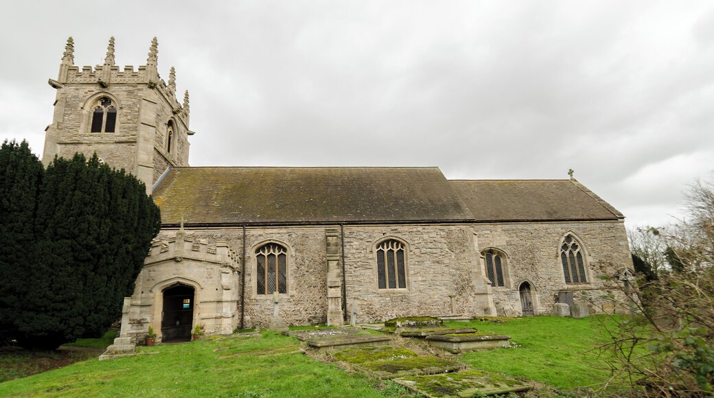 The church dates from the early 12th century onwards, with evidence of Norman herringbone masonry. The church was restored in the 19th century and again in 1907. There is a western tower, aisleless nave, south porch and chancel. The tower is of two stages and is topped by a parapet with shields and eight crocketted pinnacles with gargoyles. The upper portion of the tower is later than the base, 14th to 15th century. There are six bells. The south porch dates from the early 16th century, and has its own gargoyles. There are coats of arms referring to Sir Thomas Sutton above the door. The inner doorway is 15th century. The chancel has Early English windows, and was lengthened around 1400. The screen dates from a similar time (although is much restored). The chancel has a barrel roof which was installed in 1858. Located on the north wall of the chancel adjacent to the altar, is a monument to Sir William Sutton, died 1611, and his wife Susannah. He is shown in the usual supine position with his hands in prayer alongside his wife. Unfortunately the hands were replaced after they were vandalised in 1984, and the monument was sprayed with paint. There is also a monument to Sir William's son, Robert, who died in 1668. His heart is said to be contained within the urn at the top. There are several 19th-century stained-glass windows, and a two light window of mediaeval glass which was reset by J. H. Sutton of Brant Broughton, circa 1885. There is also 20th century glass by Hincks and Burnell of Nottingham.