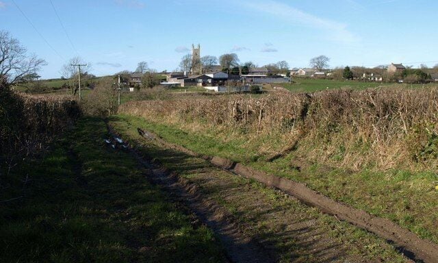 Track from Furze Cross The track is signed as unsuitable for motor vehicles. It links the lanes at Furze Cross to Churchtown, Bridgerule across a little valley, and St Bridget's Church can be seen in the background.