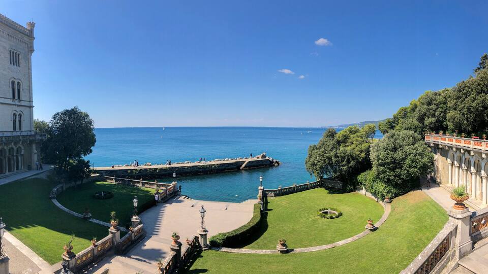 Entrance to the historical museum and park of Miramare castle, Trieste, Friuli-Venezia Giulia. 09-05-2021. People strolling in the open air by the sea. Italy