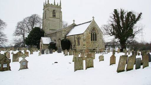 Parish church of St George the Martyr, Clifton, Nottinghamshire, seen from the southeast in the snow