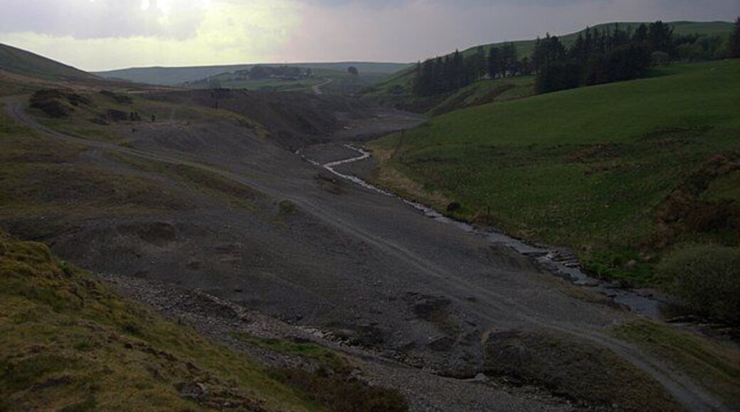 Dylife lead mines. The river bed of the Nant Dropyns or Afon Twymyn just downstream of Dylife (295469). The lead mining has left severe traces on the landscape: little vegetation can cope with the heavy metal concentration. I'm not clear about the name of the river at this point. My understanding was that it is called Nant Dropyns until it merges into the Nant Bryn-moel, which in turn becomes the Afon Twymyn downstream of the waterfall (809282) into the glacial Cwm Twymyn (809243). Fellow Geographer David Neal names this section, pictured from the opposite end (227660), Afon Twymyn.