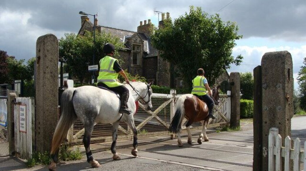 Level crossing at Fiskerton Station - with horse riders The Trent Valley Equestrian Centre is not far away.