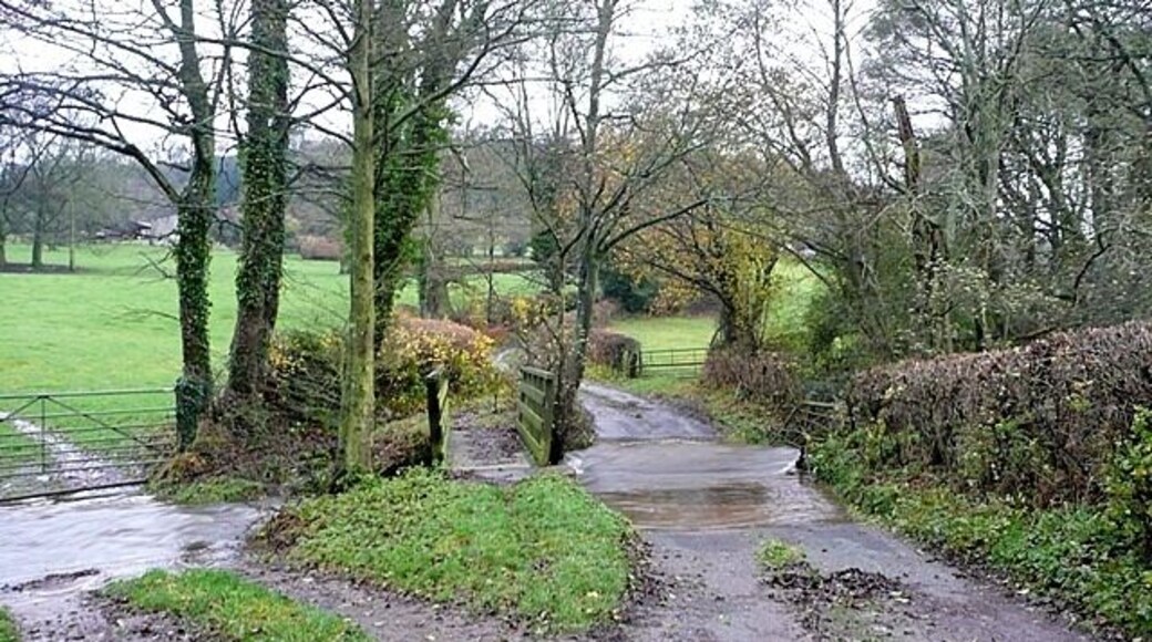 Ford south of Mardu I was interested to see how close to the gridline this ford is. My GPS confirmed that the water and the footbridge are wholly within SO2683 but the road this side is in SO2783, making this a supplemental picture. The ford was too deep to drive through today. Beyond, the land rises towards The Tump.