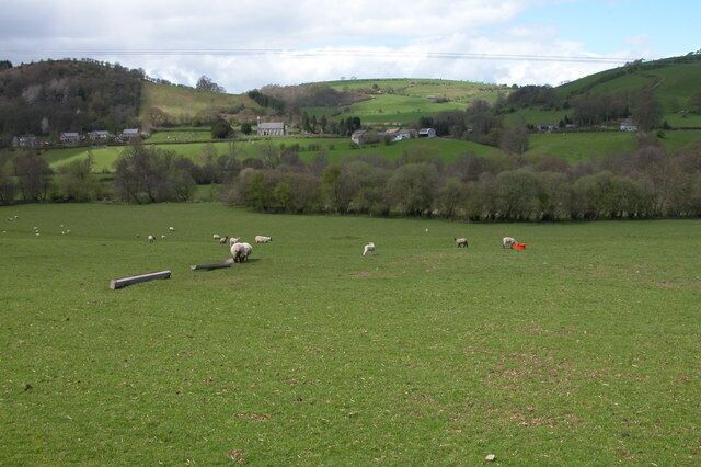The Clun Valley at Newcastle. View across the valley to the church at Newcastle. Out of picture to the right is Offa's Dyke. The Long Distance Path follows the dyke across this valley, here the dyke is only a fairly low bank.