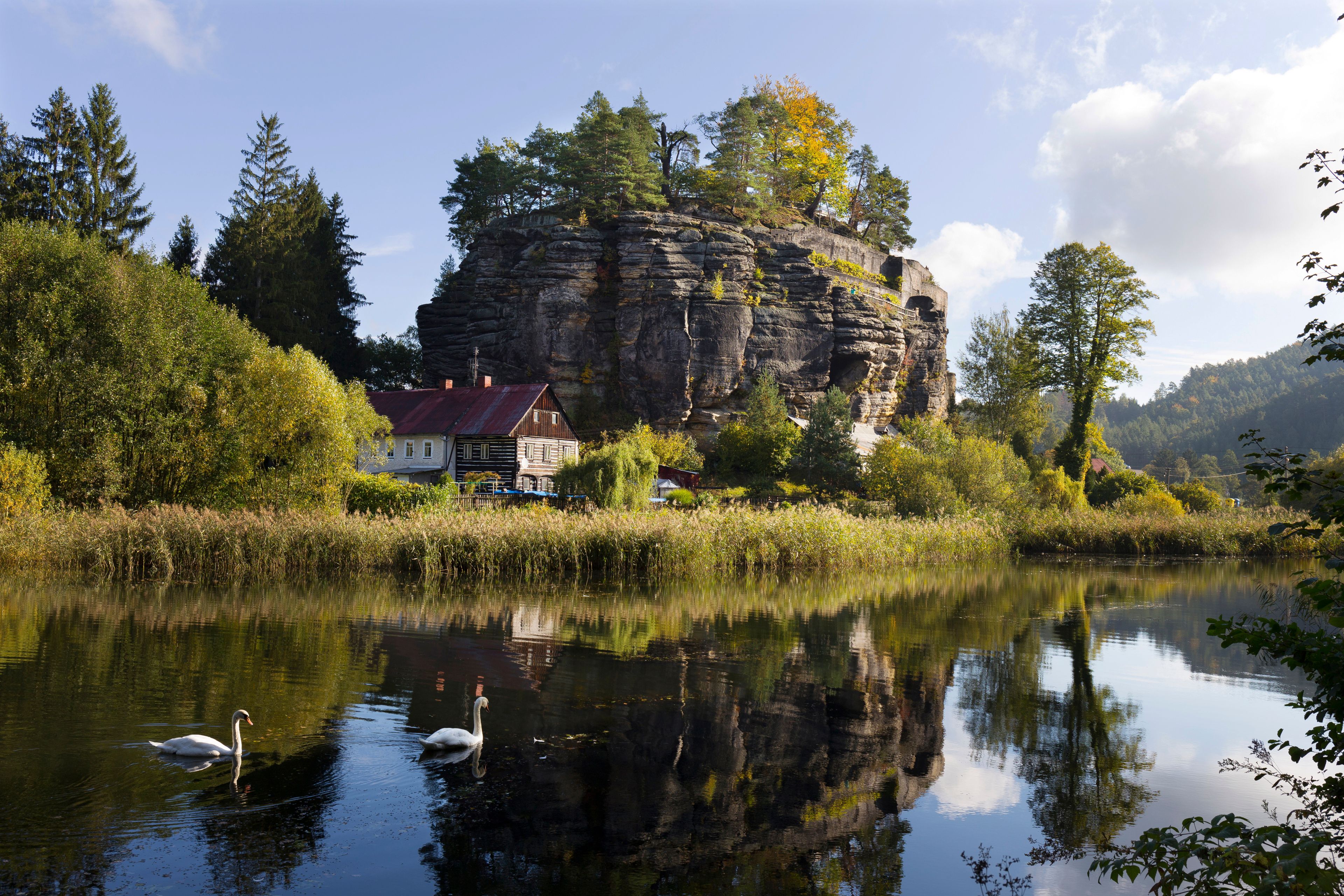 Impregnable medieval rock castle Sloup from the 13th century with Castle pond in northern Bohemia, Czech Republic