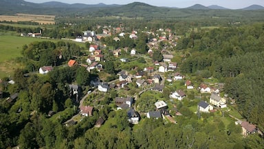 A village nestled in a valley surrounded by hills.