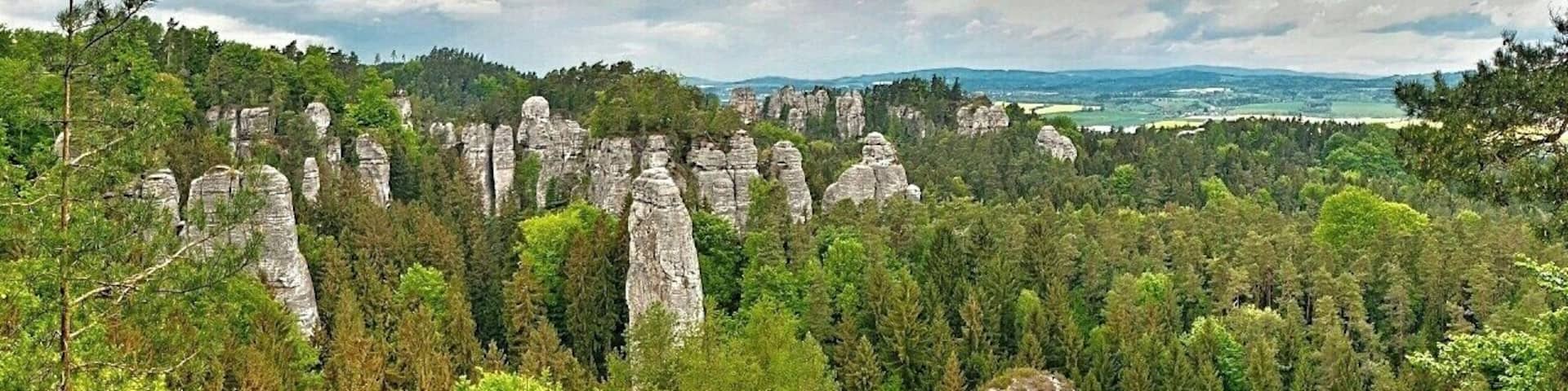 May 2015
Vyhlídka na Kapelu, Hrube rocks, Bohemian Paradise, Czech republic
Bohemian Paradise (=Český Ráj) is a nature reserve protected area established in 1955 and it is located in North Bohemia. It has a varied country side with plenty of first and beech surrounding wonderful sandstone rock formations. The water, wind and frost erosion has left many uniquely shaped rock towers having up to 60 meters of height and these are a popular place for Czech rock climbers for decades.
View of the main part of Hrube rocks in Bohemian Paradise. It is called View of the Orchestra. The Orchestra is the group of the sandstone towers on the left, with one needle standing before them, which is called the Dirigent.